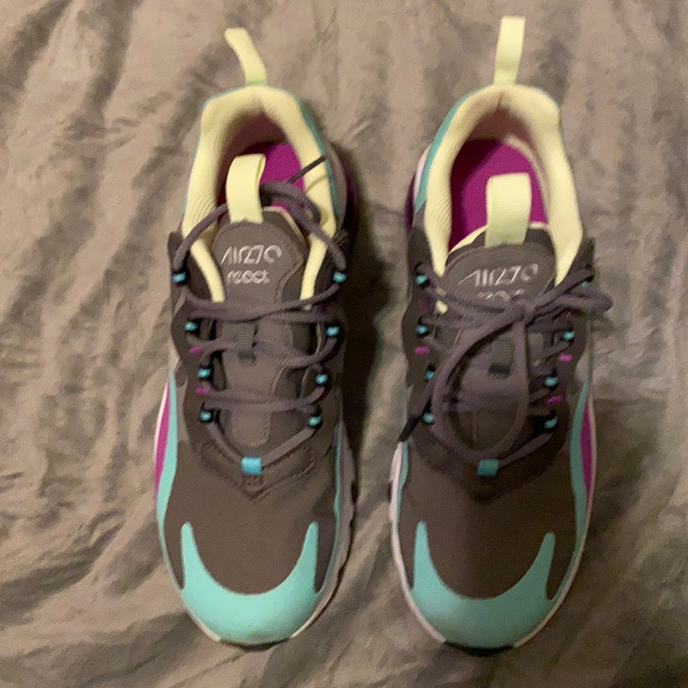 These are some teal, light green, grey, & purple tennis shoes .